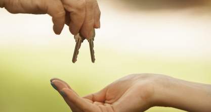 Handing the keys to a new home owner