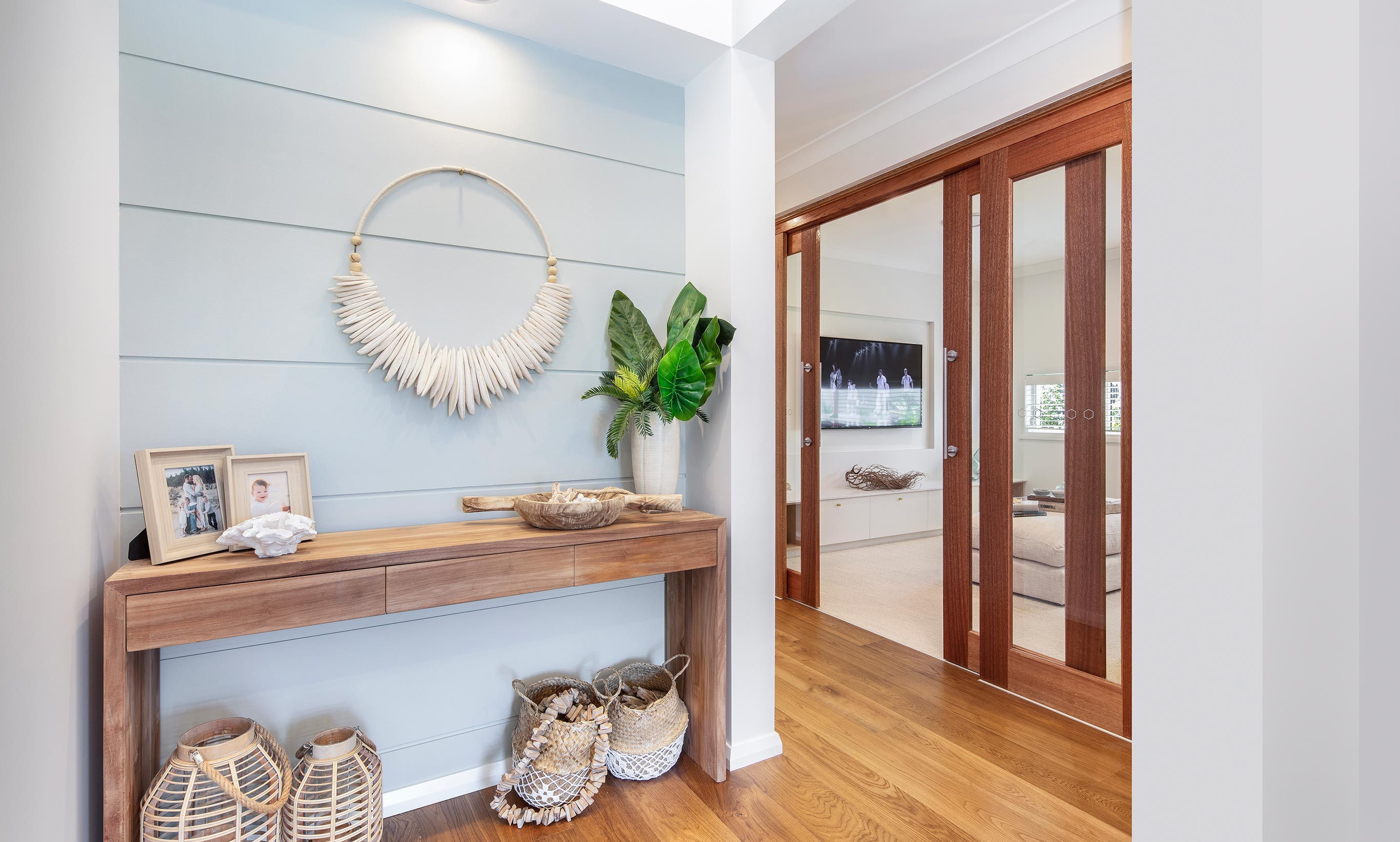 The Coolum at HomeWorld Warnervale features a soft coastal blue - seen in feature walls, cabinetry and furnishings throughout this stunning coastal styled home.