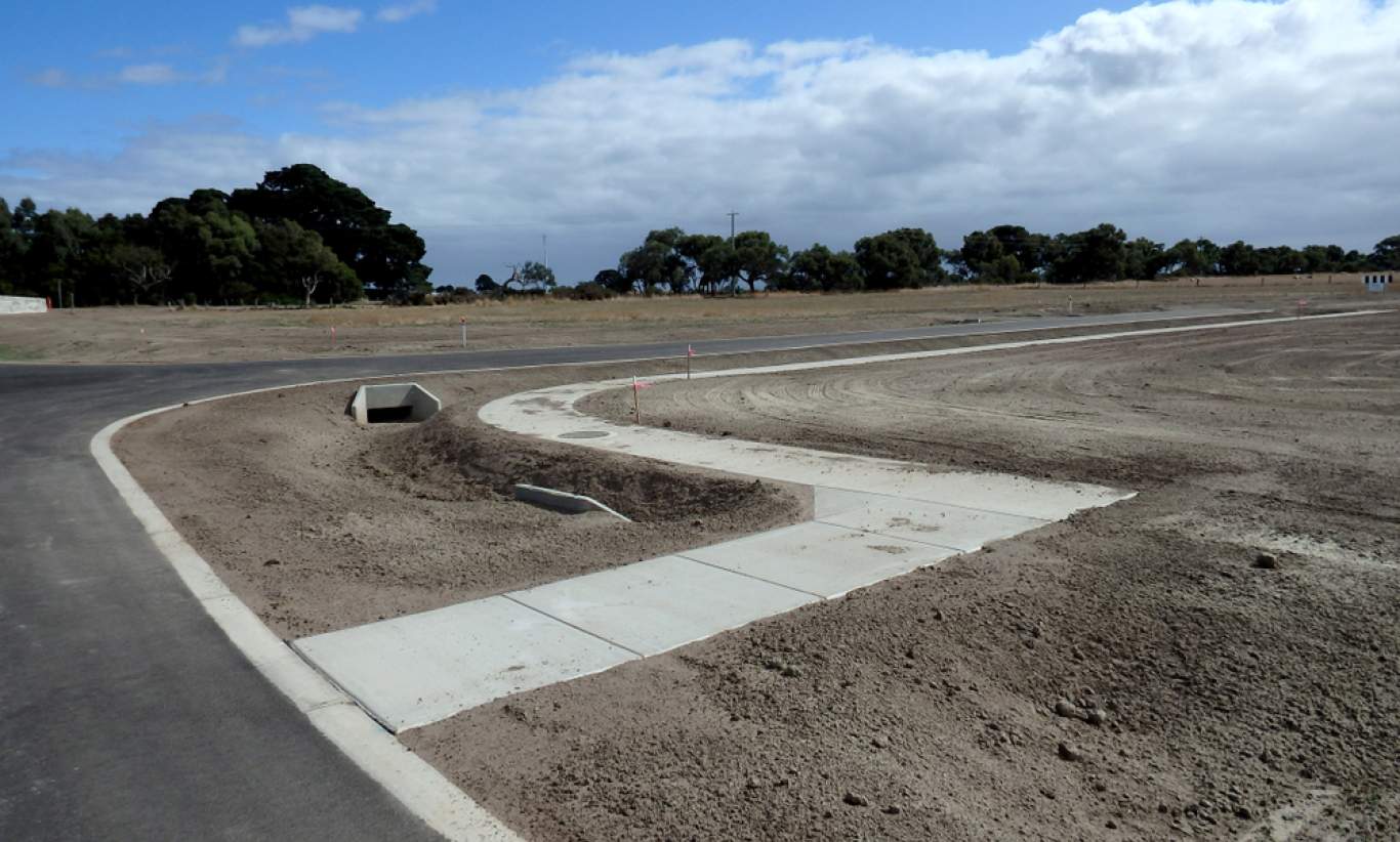 Streets ready in new estate development, site of growth area no houses stage in new under construction residential suburb land