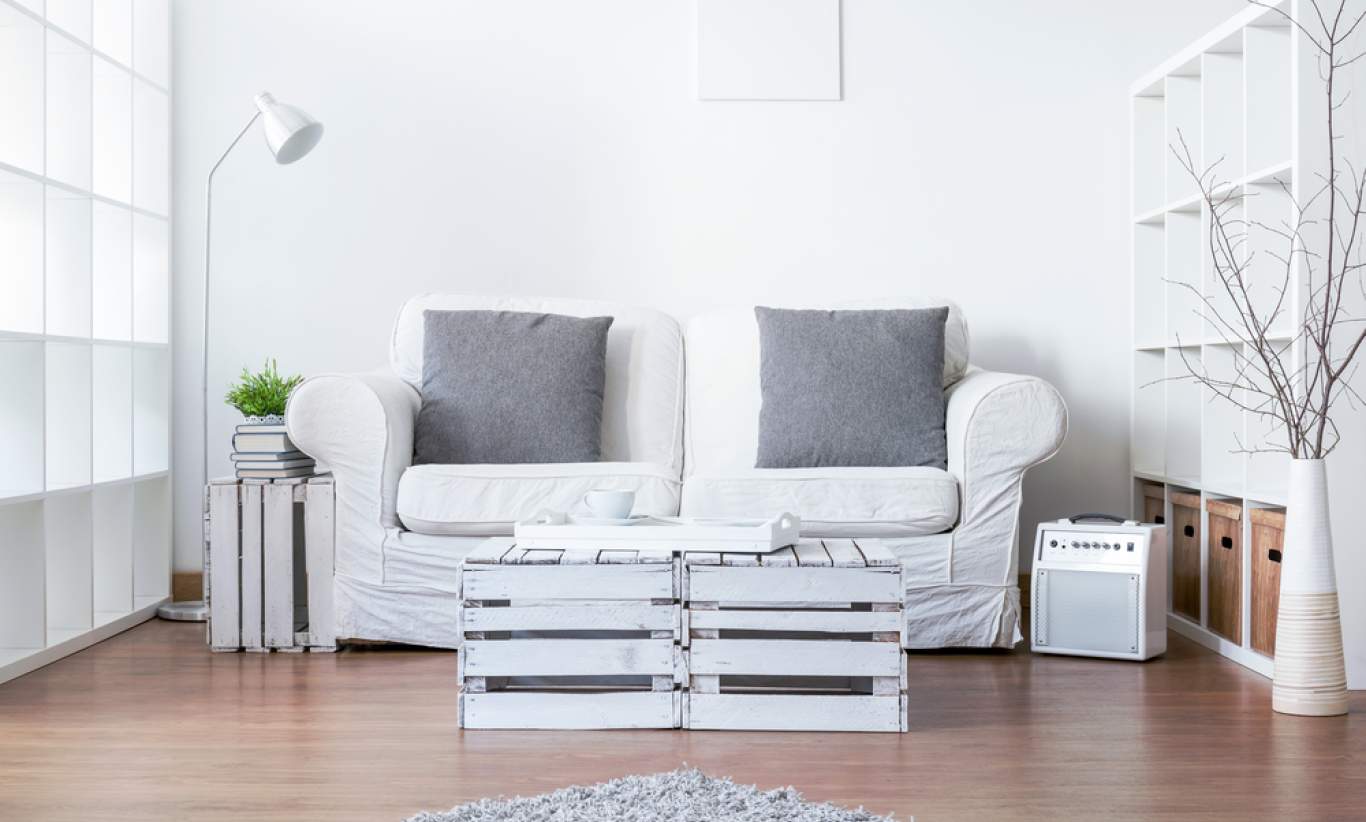 Modern living room with sofa and DIY pallet table.