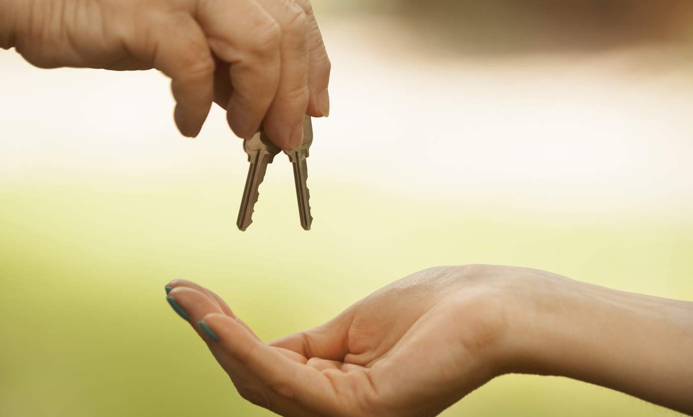 Handing the keys to a new home owner