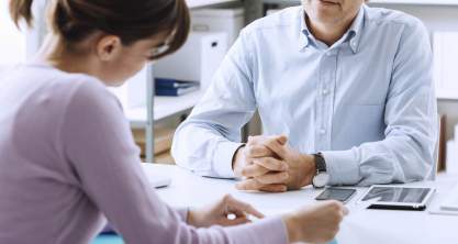 An advisor talking to a client about their first home purchase